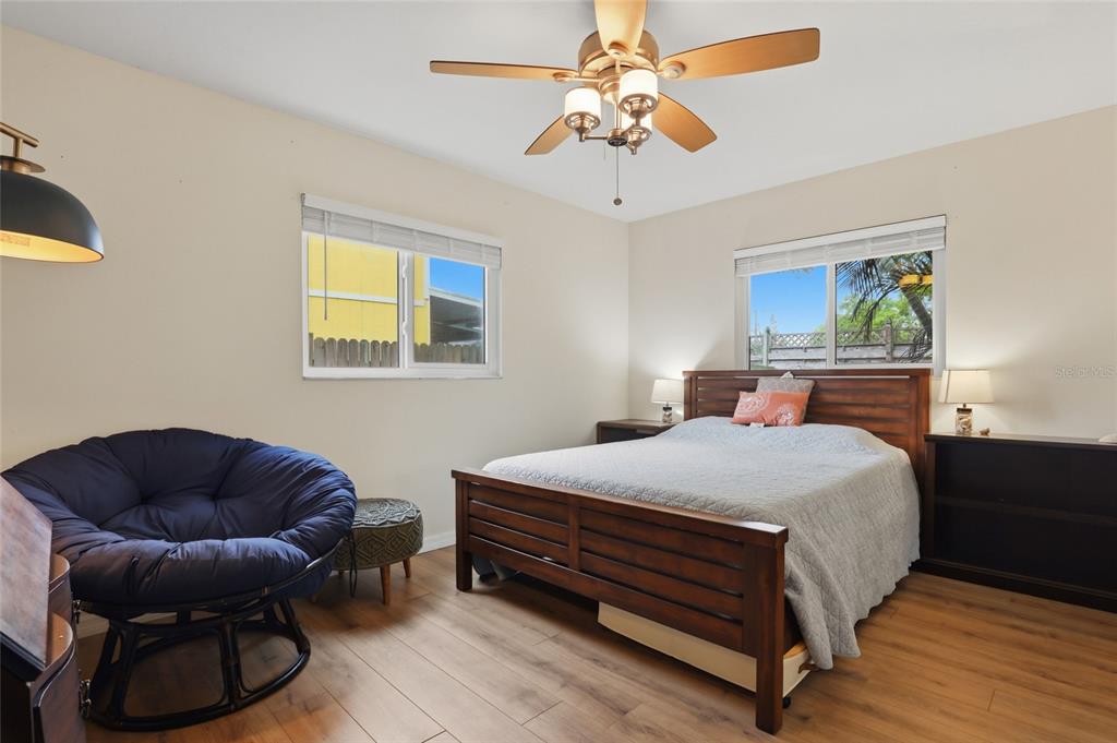 4576 Bliss Road Sarasota, FL 34233 - Photo 24 of 40 a bedroom with a bed couch and window