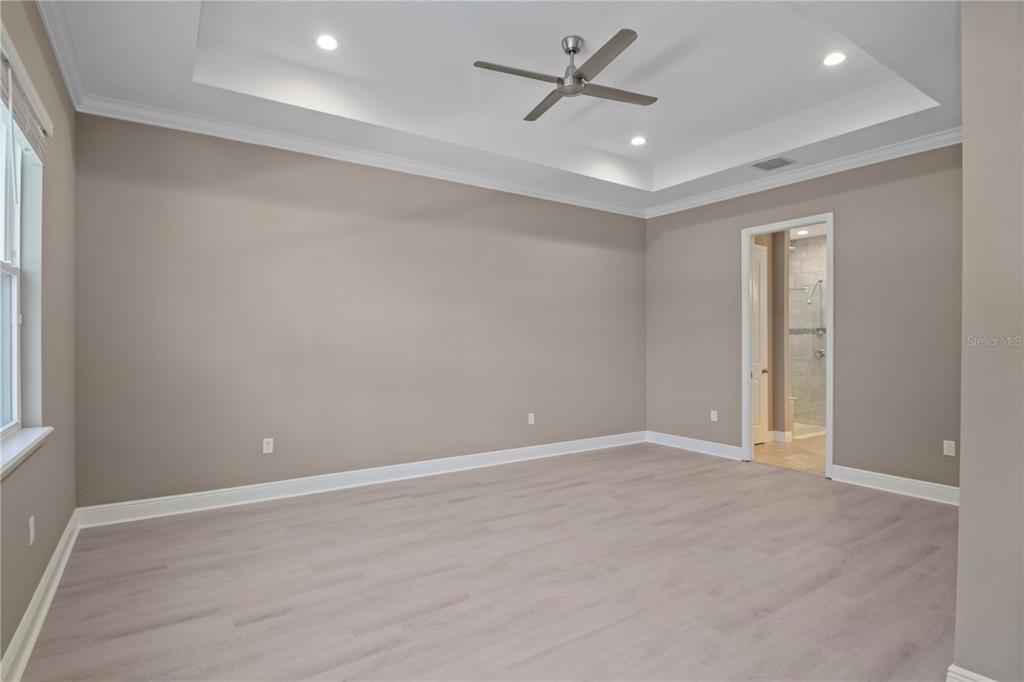 1427 Lake Florence Way Winter Park, FL 32792 - Photo 11 of 32 an empty room with windows and fan
