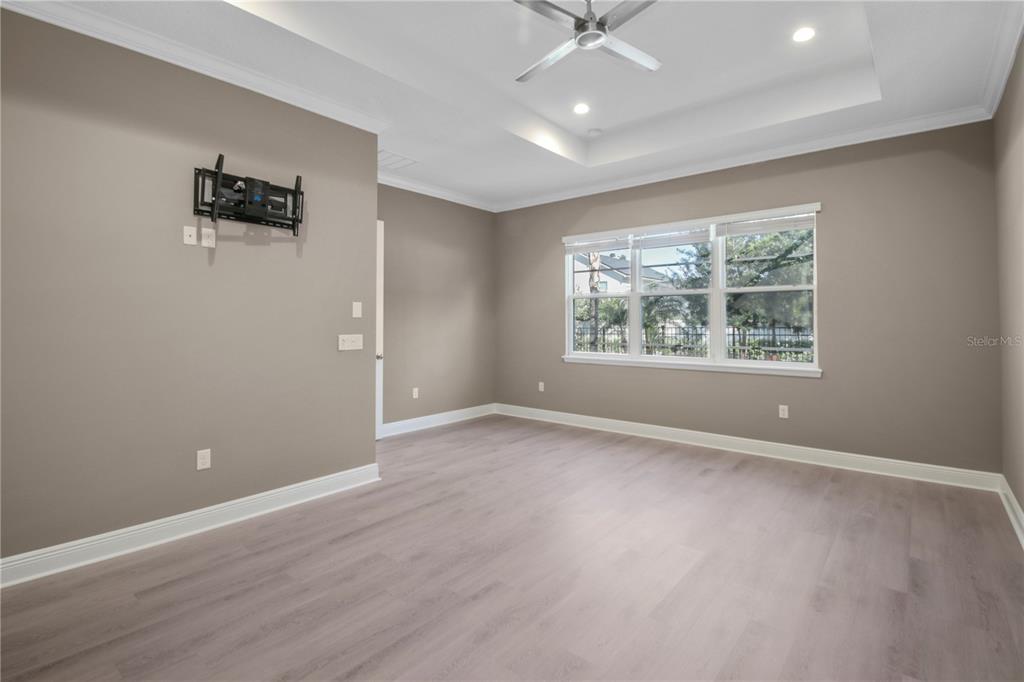 1427 Lake Florence Way Winter Park, FL 32792 - Photo 14 of 32 an empty room with windows and ceiling fan
