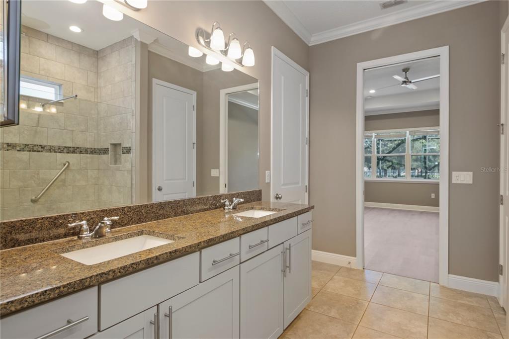 1427 Lake Florence Way Winter Park, FL 32792 - Photo 16 of 32 a bathroom with a granite countertop sink and a mirror
