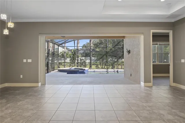 a view of hallway with furniture and a large window