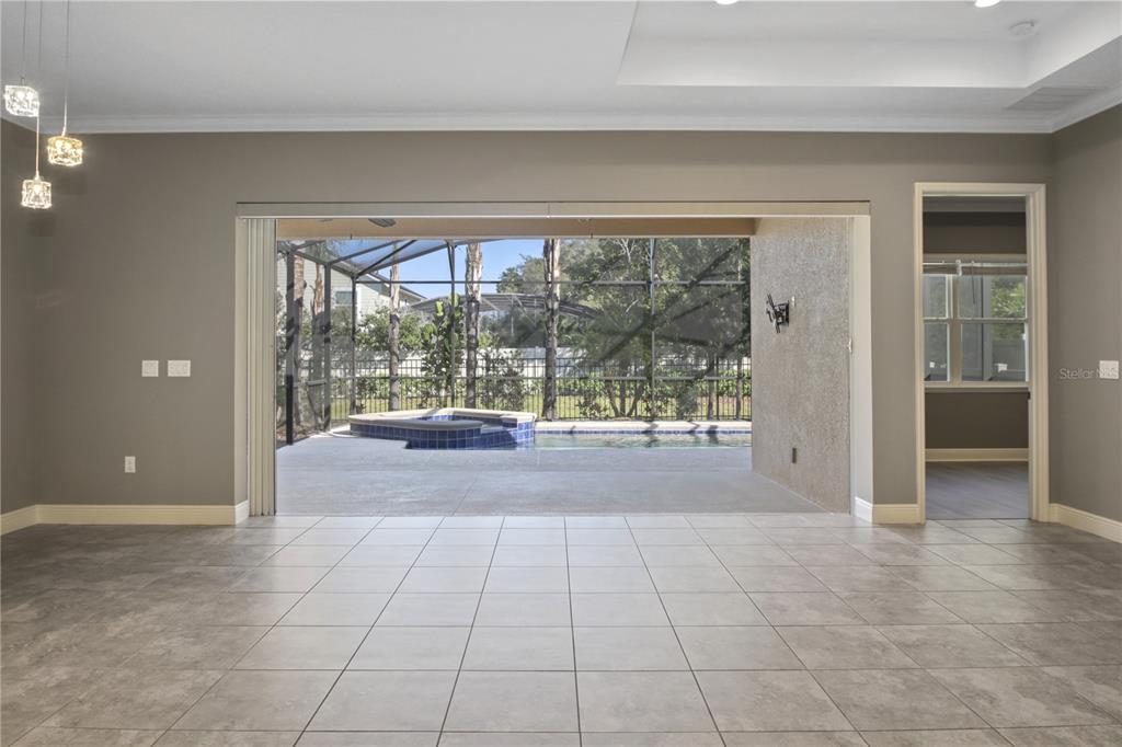 1427 Lake Florence Way Winter Park, FL 32792 - Photo 19 of 32 a view of hallway with furniture and a large window
