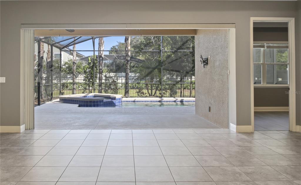 1427 Lake Florence Way Winter Park, FL 32792 - Photo 4 of 32 a view of empty room with floor to ceiling windows