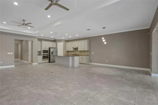 a view of kitchen with stainless steel appliances refrigerator