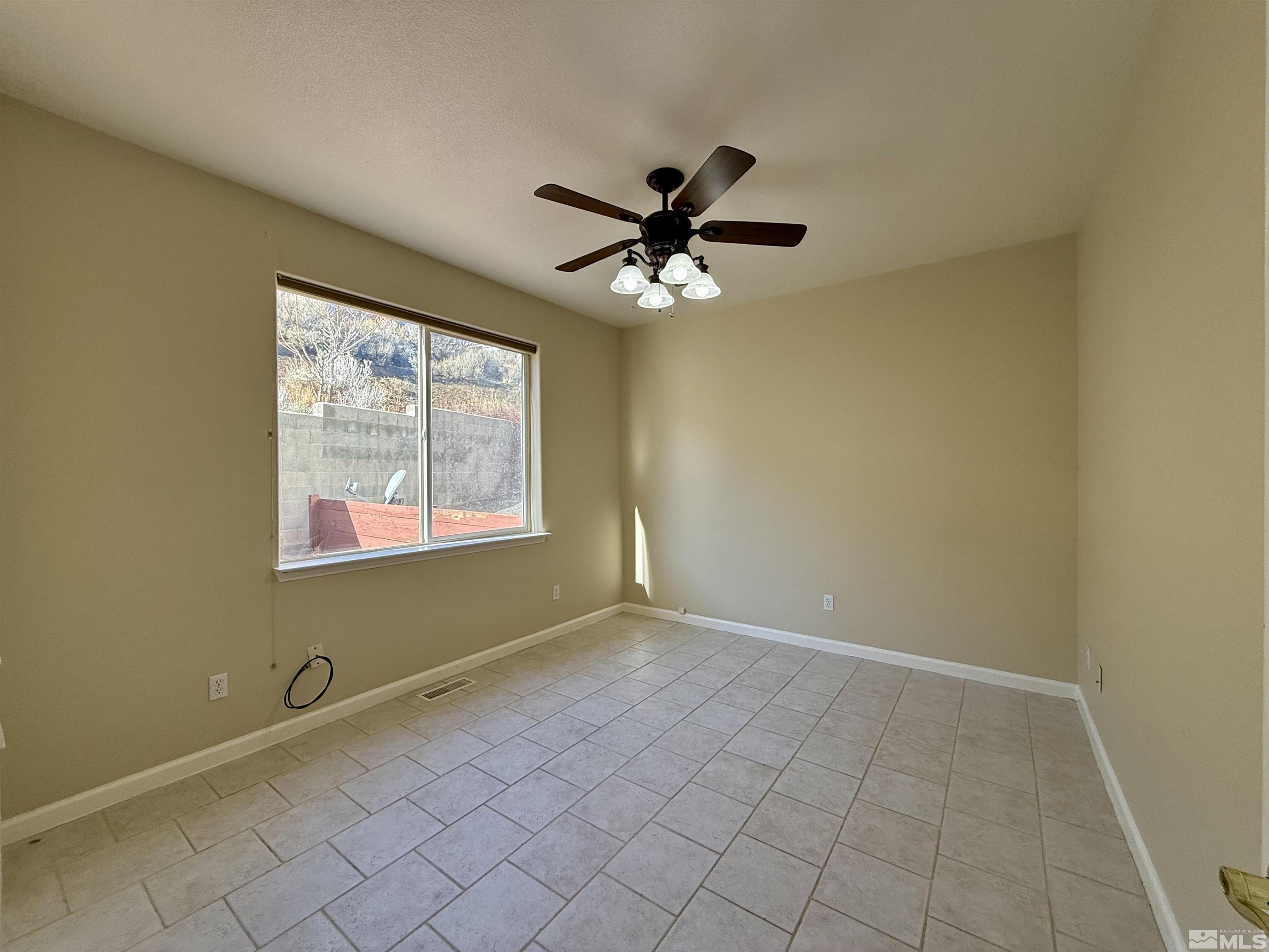 1090 Spring Drive Carson City, NV 89703 - Photo 13 of 31 a view of an empty room with a window
