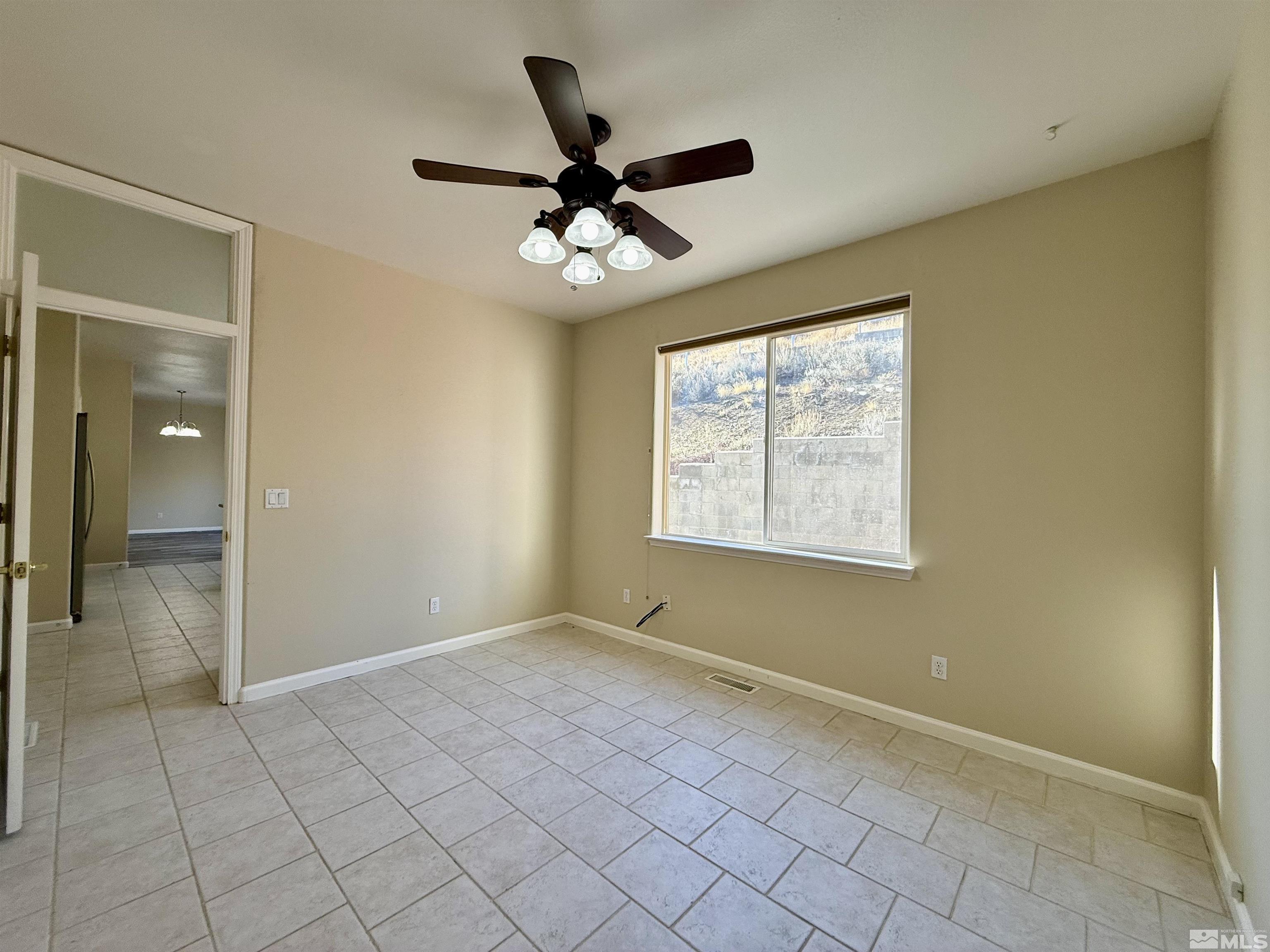 1090 Spring Drive Carson City, NV 89703 - Photo 14 of 31 a view of an empty room with a window