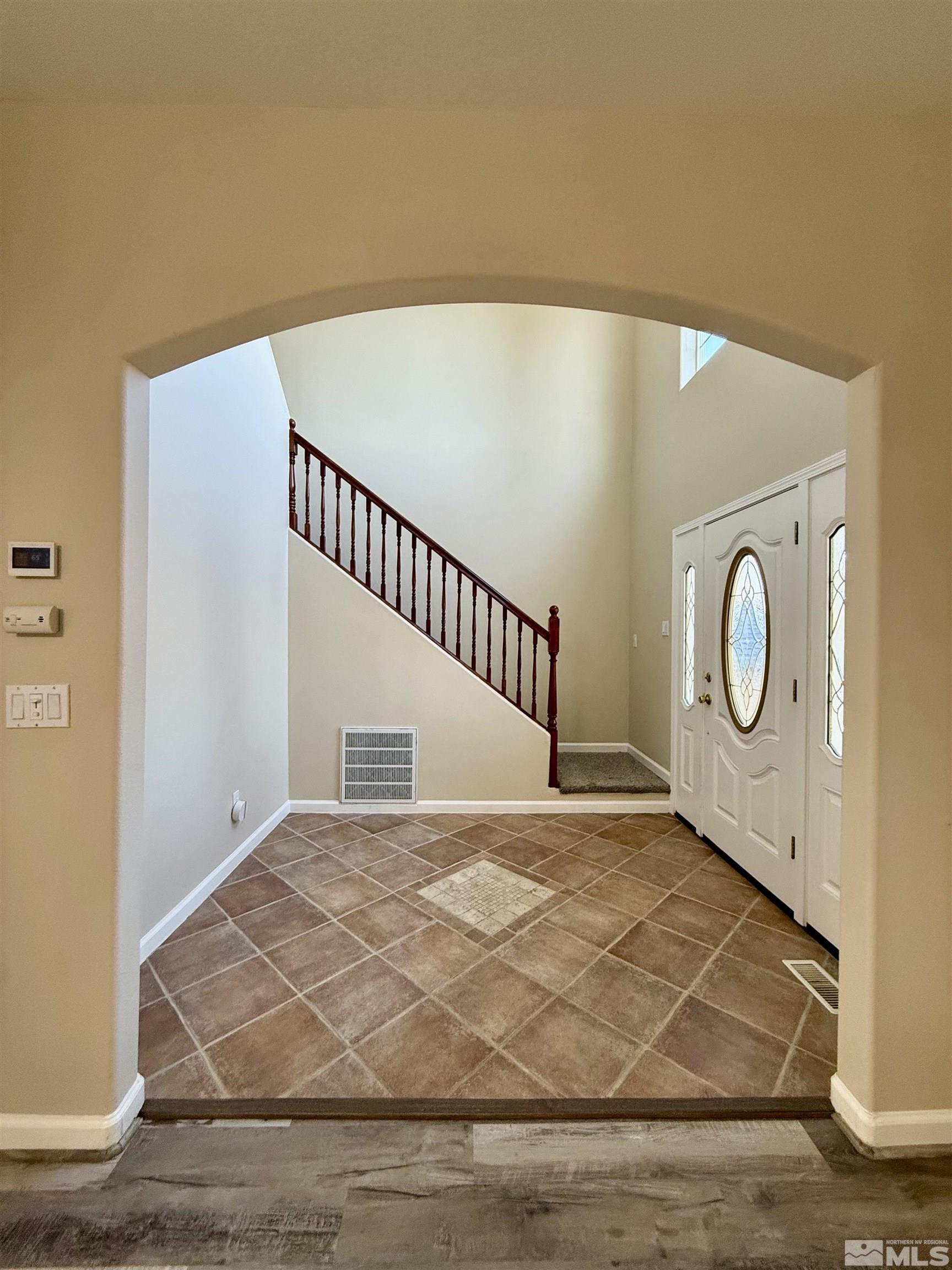 1090 Spring Drive Carson City, NV 89703 - Photo 2 of 31 a view of a room with wooden floor and windows
