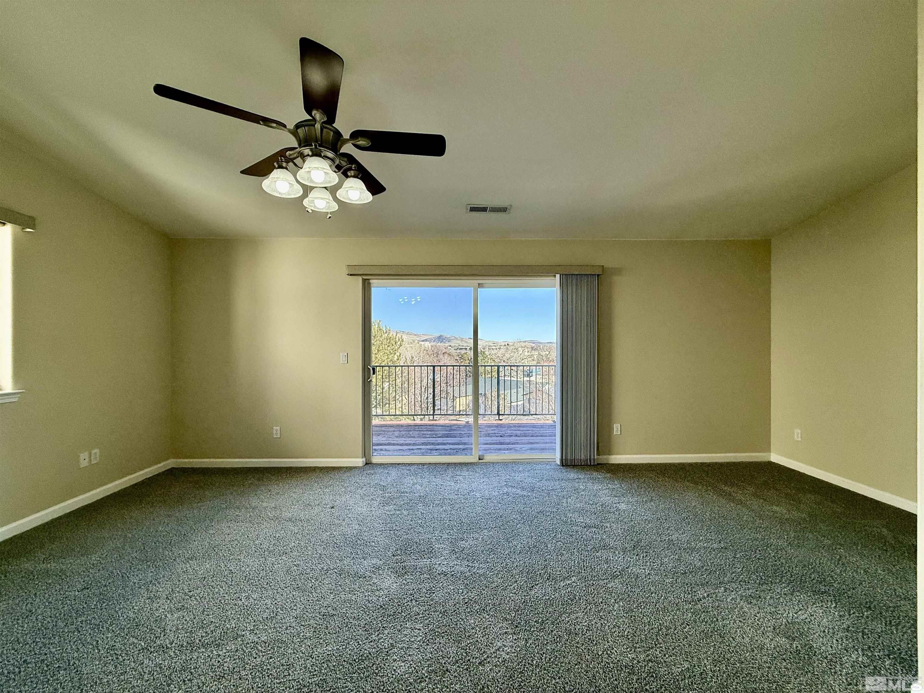 1090 Spring Drive Carson City, NV 89703 - Photo 21 of 31 a view of an empty room with a window