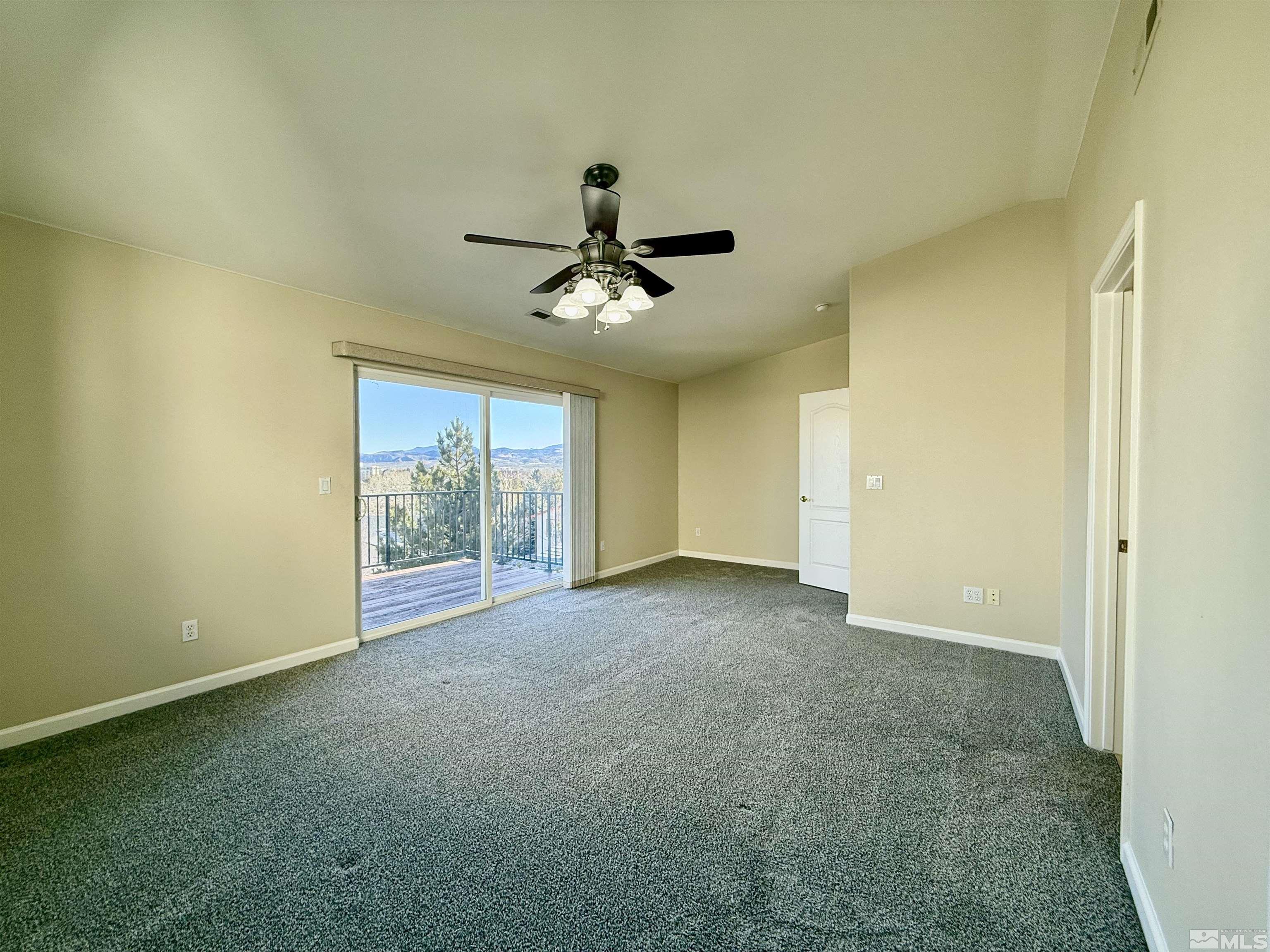 1090 Spring Drive Carson City, NV 89703 - Photo 22 of 31 a view of a room with a ceiling fan and a window