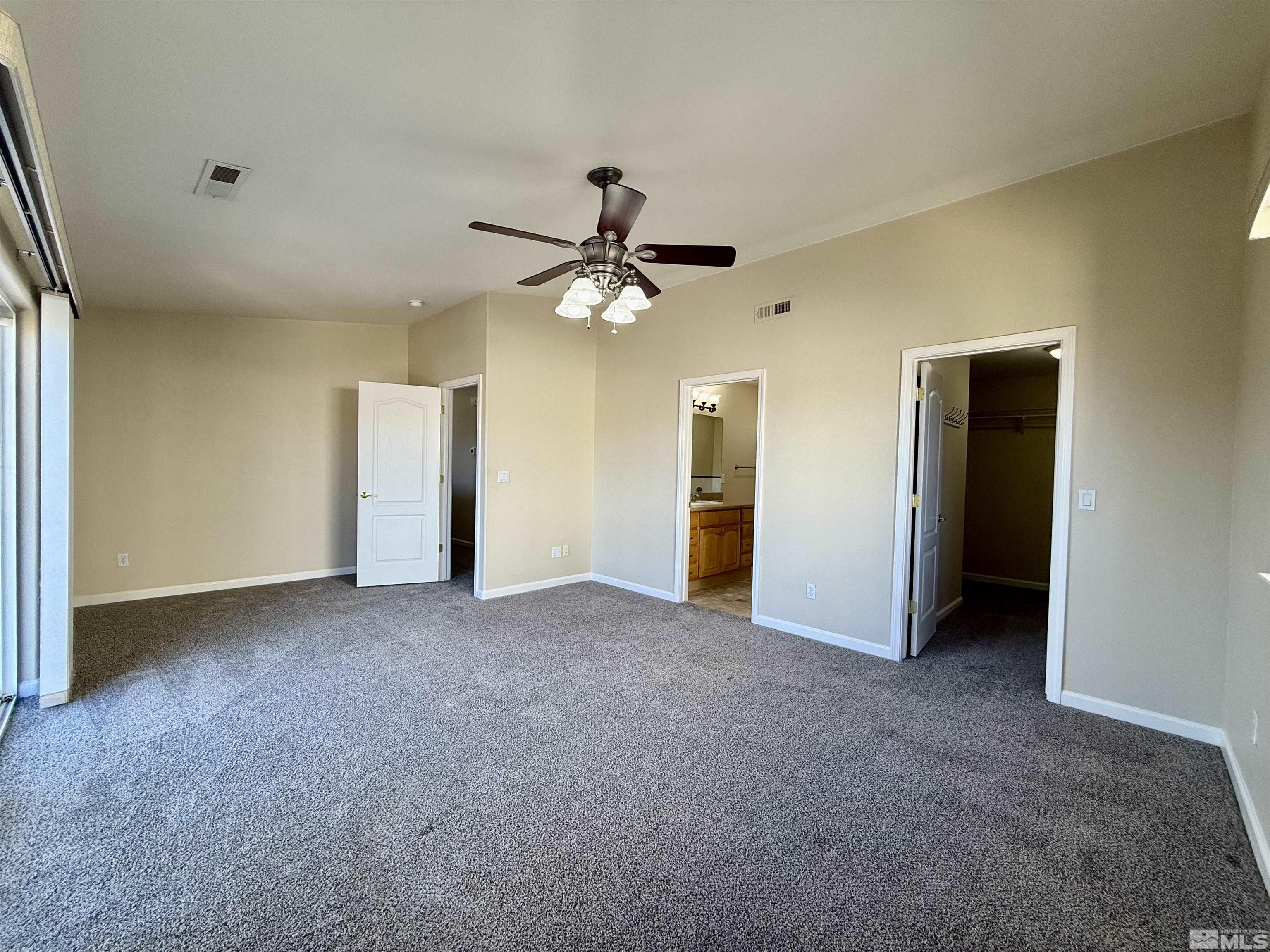 1090 Spring Drive Carson City, NV 89703 - Photo 23 of 31 an empty room with closet and a ceiling fan