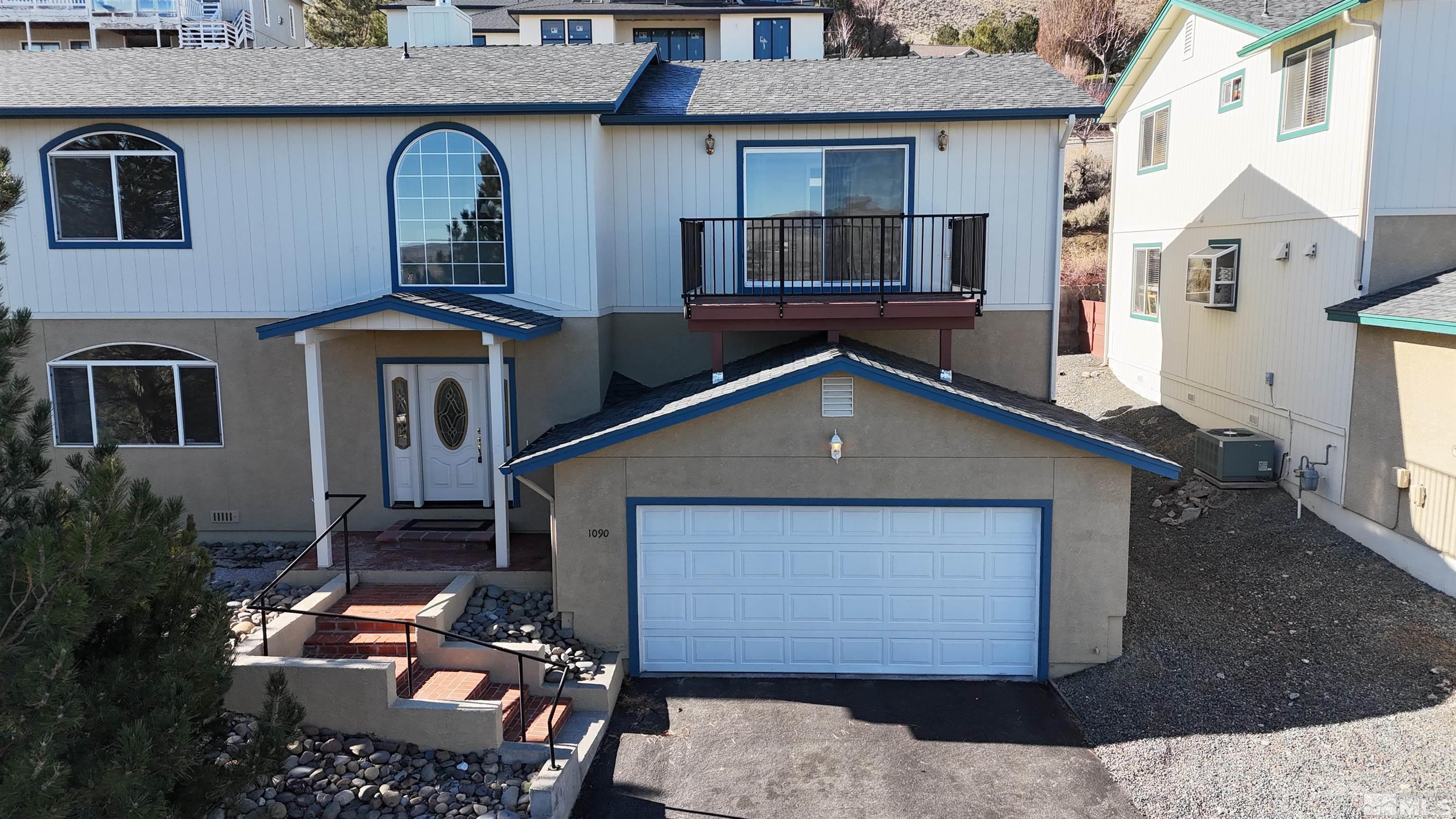 1090 Spring Drive Carson City, NV 89703 - Photo 28 of 31 a front view of a house with a yard