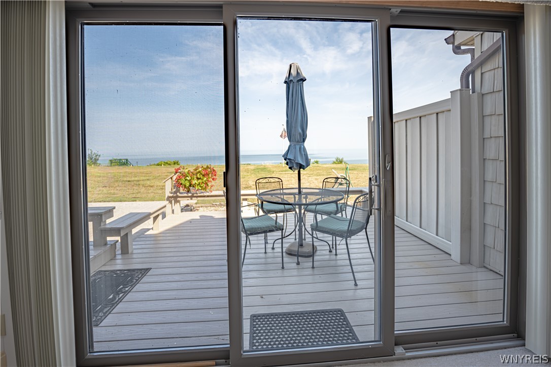 6071 East Lake Road, Unit 4 Newfane, NY 14028 - Photo 12 of 46 View from living room to deck. Sliding glass door