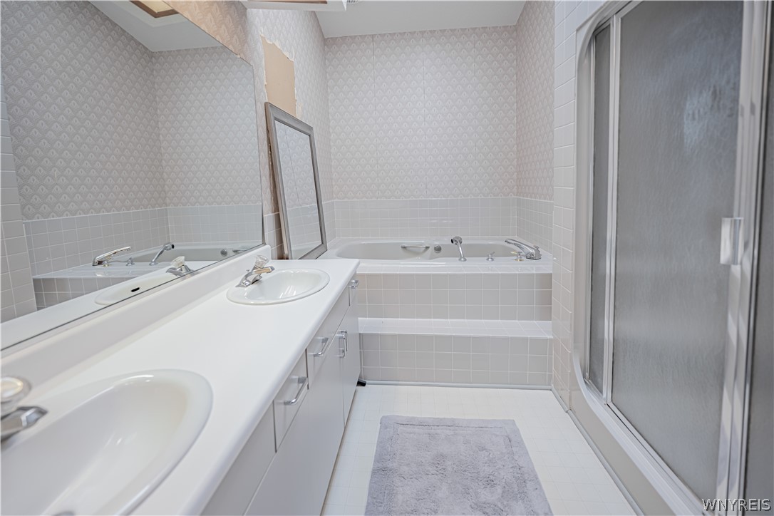 6071 East Lake Road, Unit 4 Newfane, NY 14028 - Photo 23 of 46 Master Bath with jacuzzi tub, In need of wallpaper