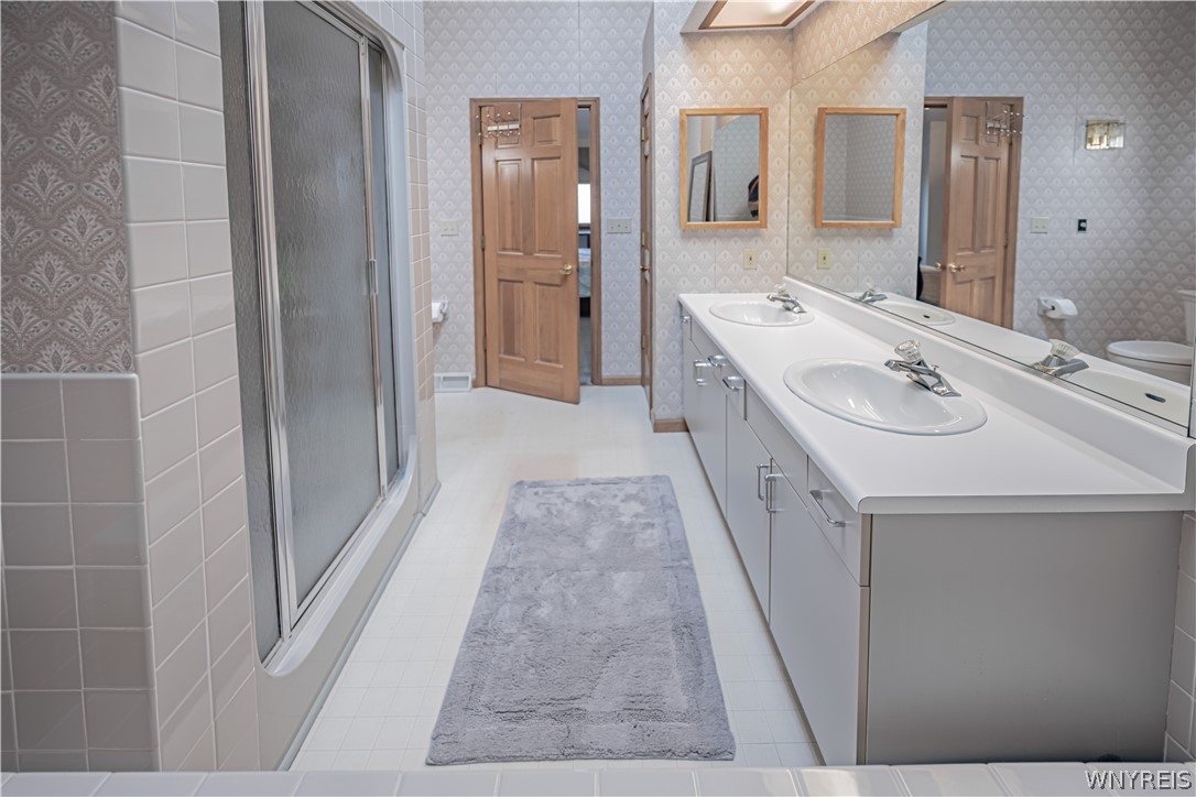 6071 East Lake Road, Unit 4 Newfane, NY 14028 - Photo 24 of 46 Master bath with double sinks, jacuzzi tub and sho