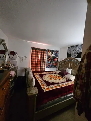 a bed room with furniture and a window