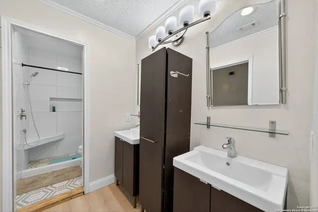 a bathroom with a sink and mirror