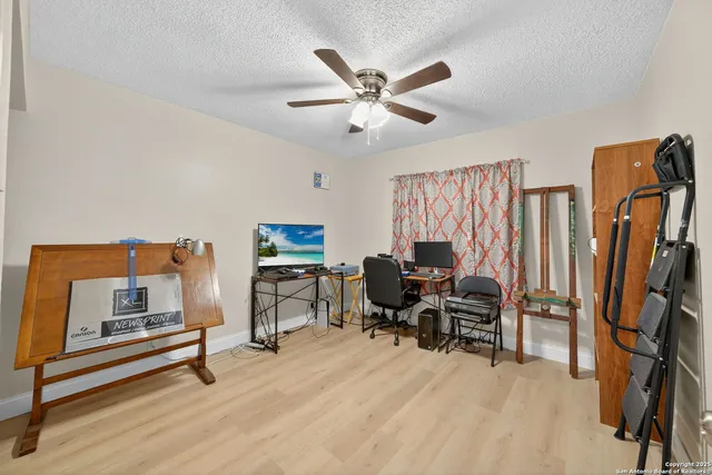 a work room with furniture and a window