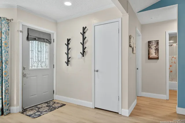 a view of a livingroom with wooden floor and closet