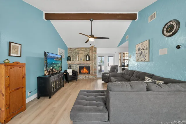 a living room with furniture and a fireplace