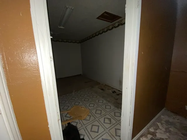 a view of empty room with windows