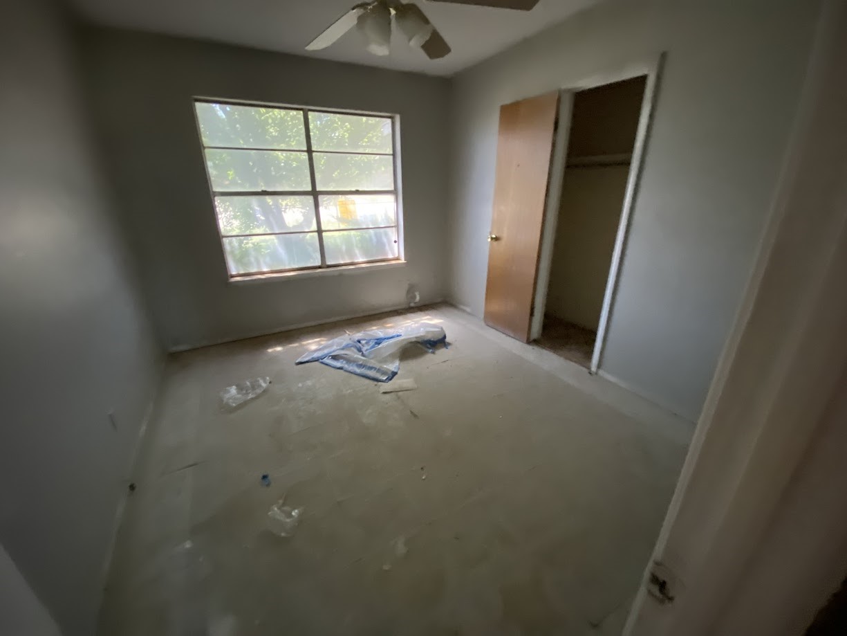 703 South Austin Avenue Tulia, TX 79088 - Photo 8 of 12 a view of empty room with windows
