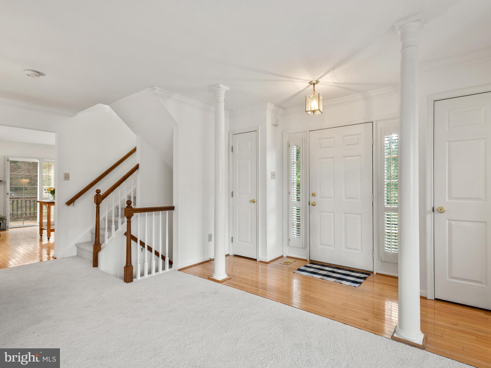 913 Harbour Ridge Lane Downingtown, PA 19335 - Photo 11 of 33 a view of a livingroom with wooden floor and stairs