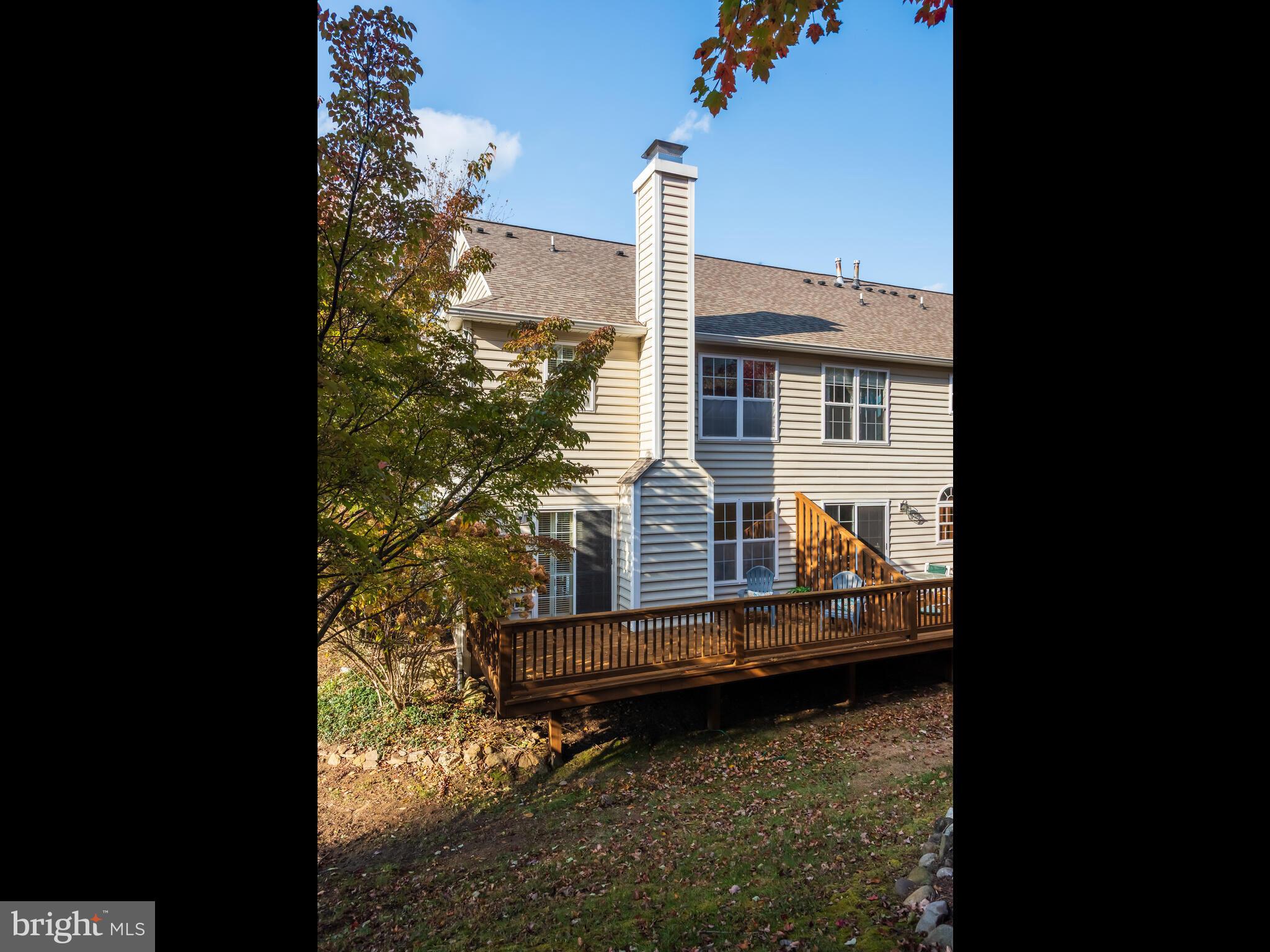 913 Harbour Ridge Lane Downingtown, PA 19335 - Photo 31 of 33 a view of a house with a yard and sitting area