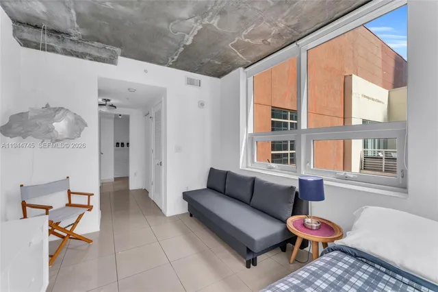 a living room with furniture and a window