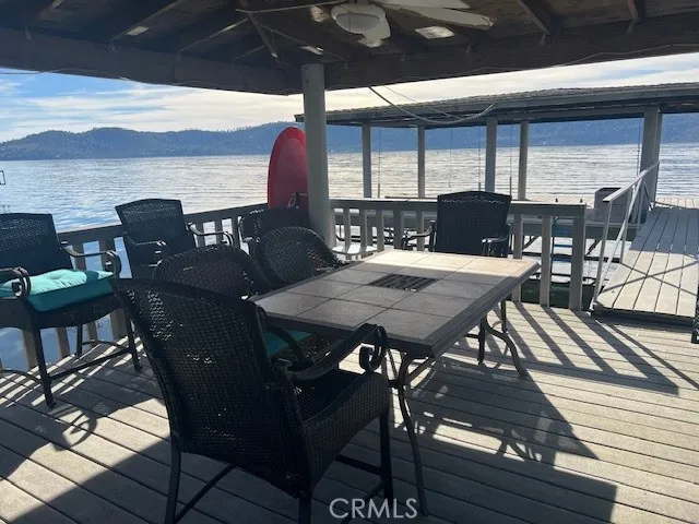 a view of a chairs and table in the balcony