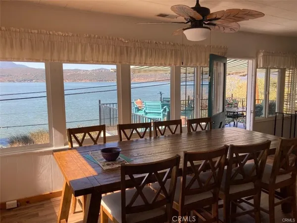a view of a dining room with furniture and window