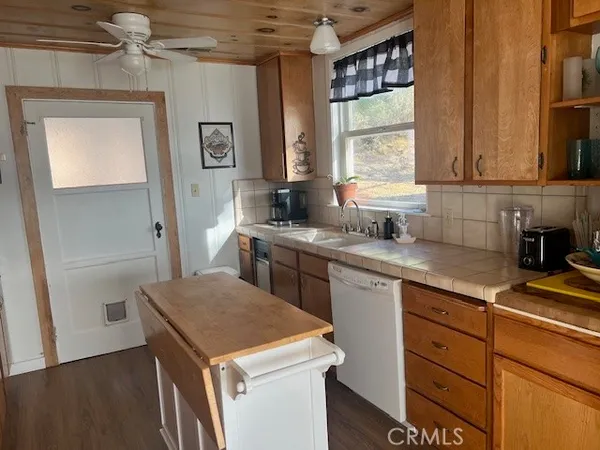 a kitchen with stainless steel appliances granite countertop a stove and a microwave