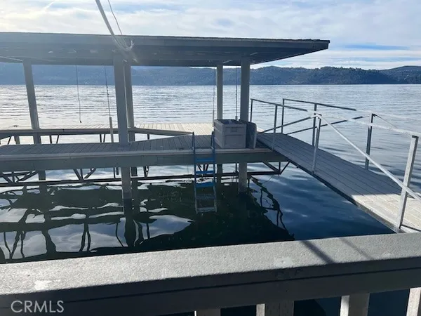 a balcony with table and chairs