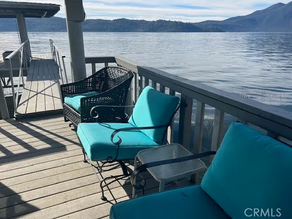 a balcony view with a seating space