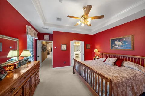 a bedroom with furniture and a chandelier