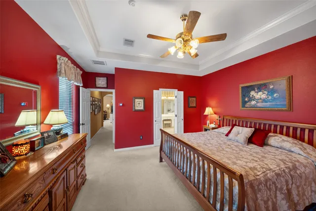 a bedroom with furniture and a chandelier