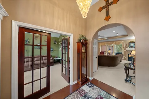 a view of a living room and a balcony