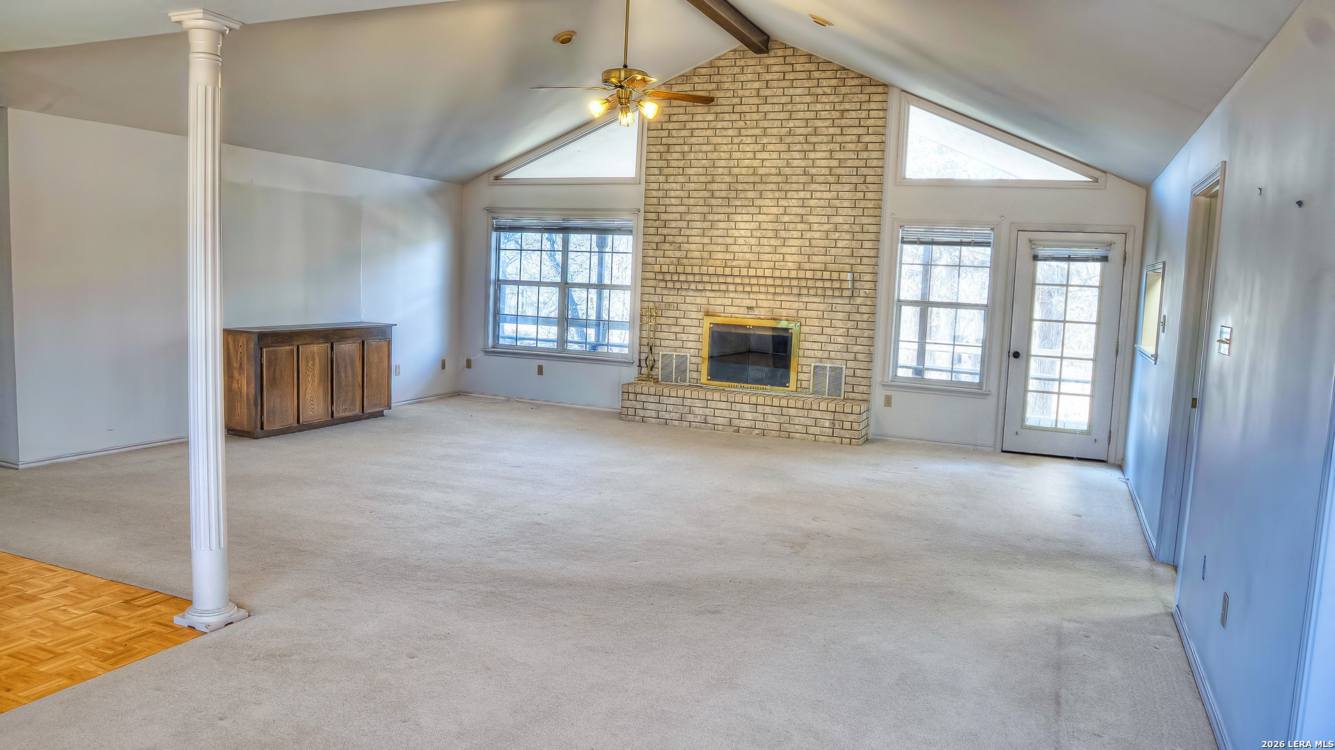 196 Canal Cir Drive Rio Frio, TX 78879 - Photo 24 of 56 an empty room with a fireplace and windows
