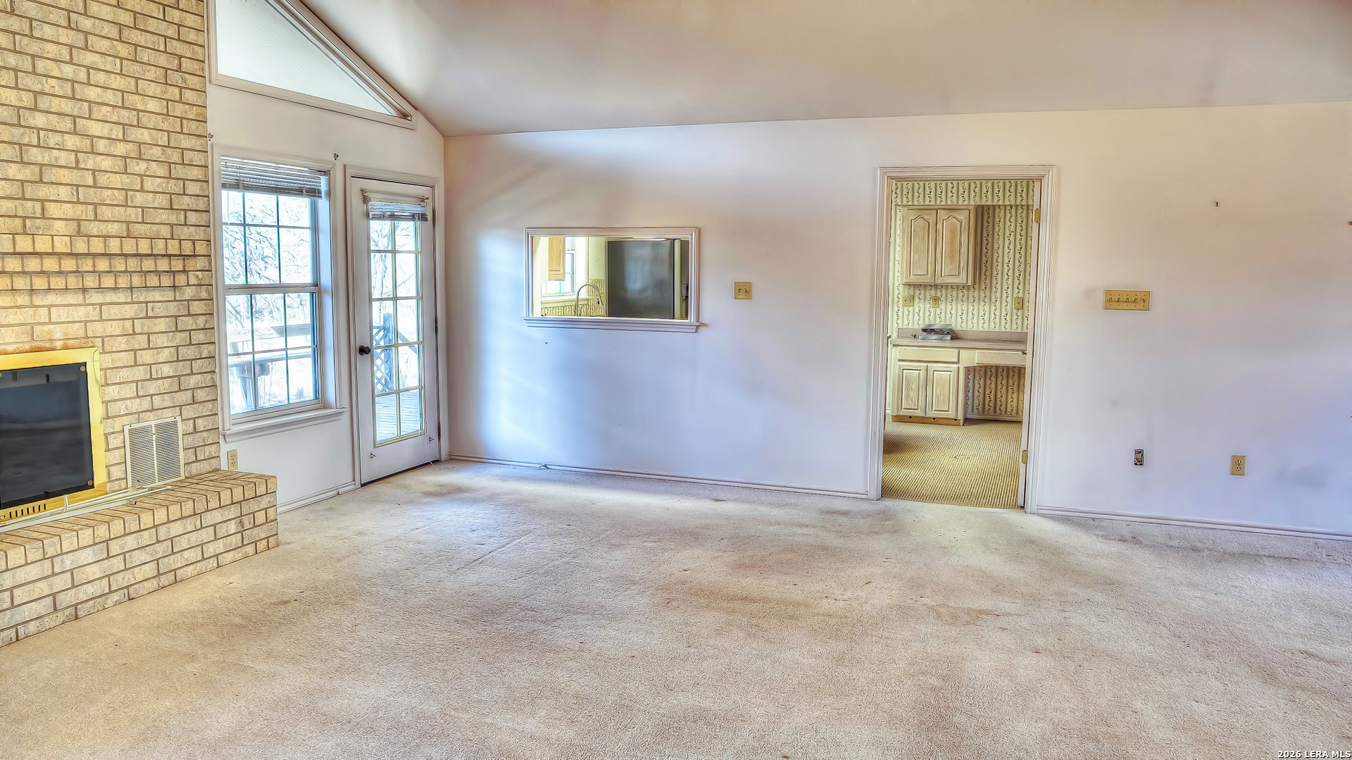 196 Canal Cir Drive Rio Frio, TX 78879 - Photo 26 of 56 an empty room with windows and entrance