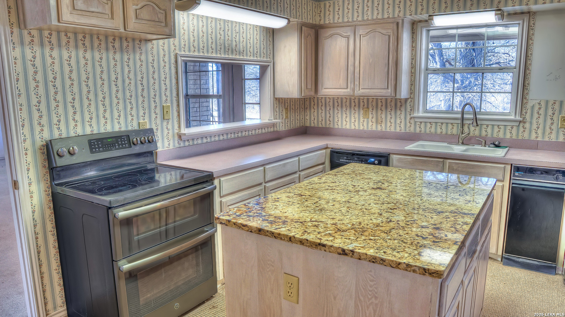 196 Canal Cir Drive Rio Frio, TX 78879 - Photo 30 of 56 a kitchen with a stove and a sink