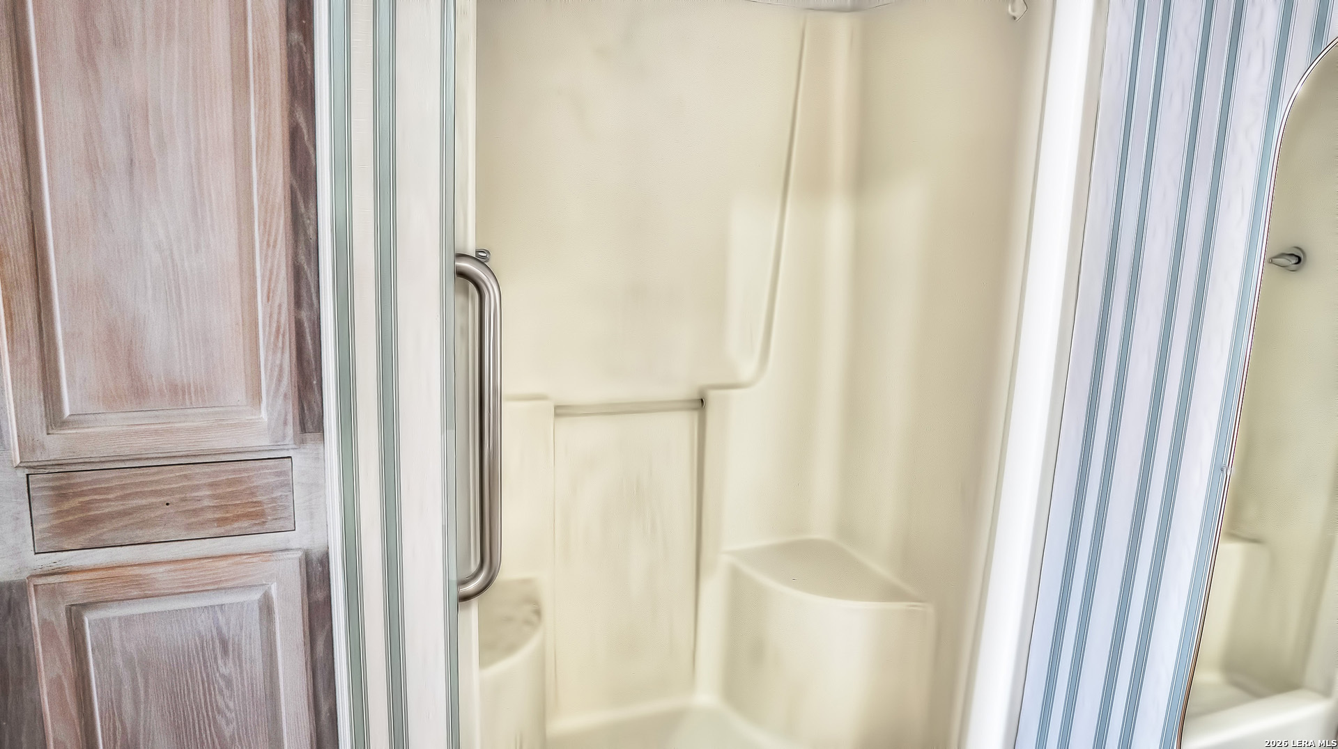 196 Canal Cir Drive Rio Frio, TX 78879 - Photo 49 of 56 a bathroom with a shower curtain