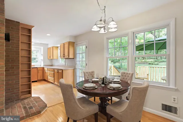 a bathroom with a bath tub with a shower