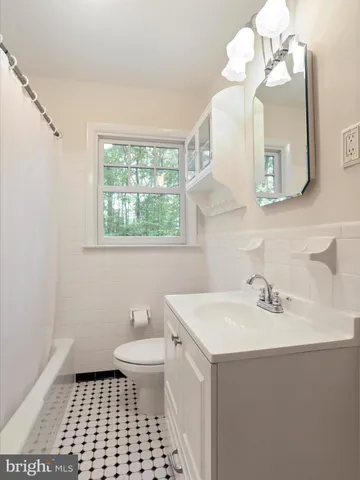 a spacious bedroom with a large bed and a window