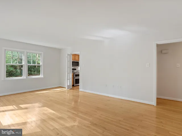 a kitchen with stainless steel appliances granite countertop a stove and a refrigerator