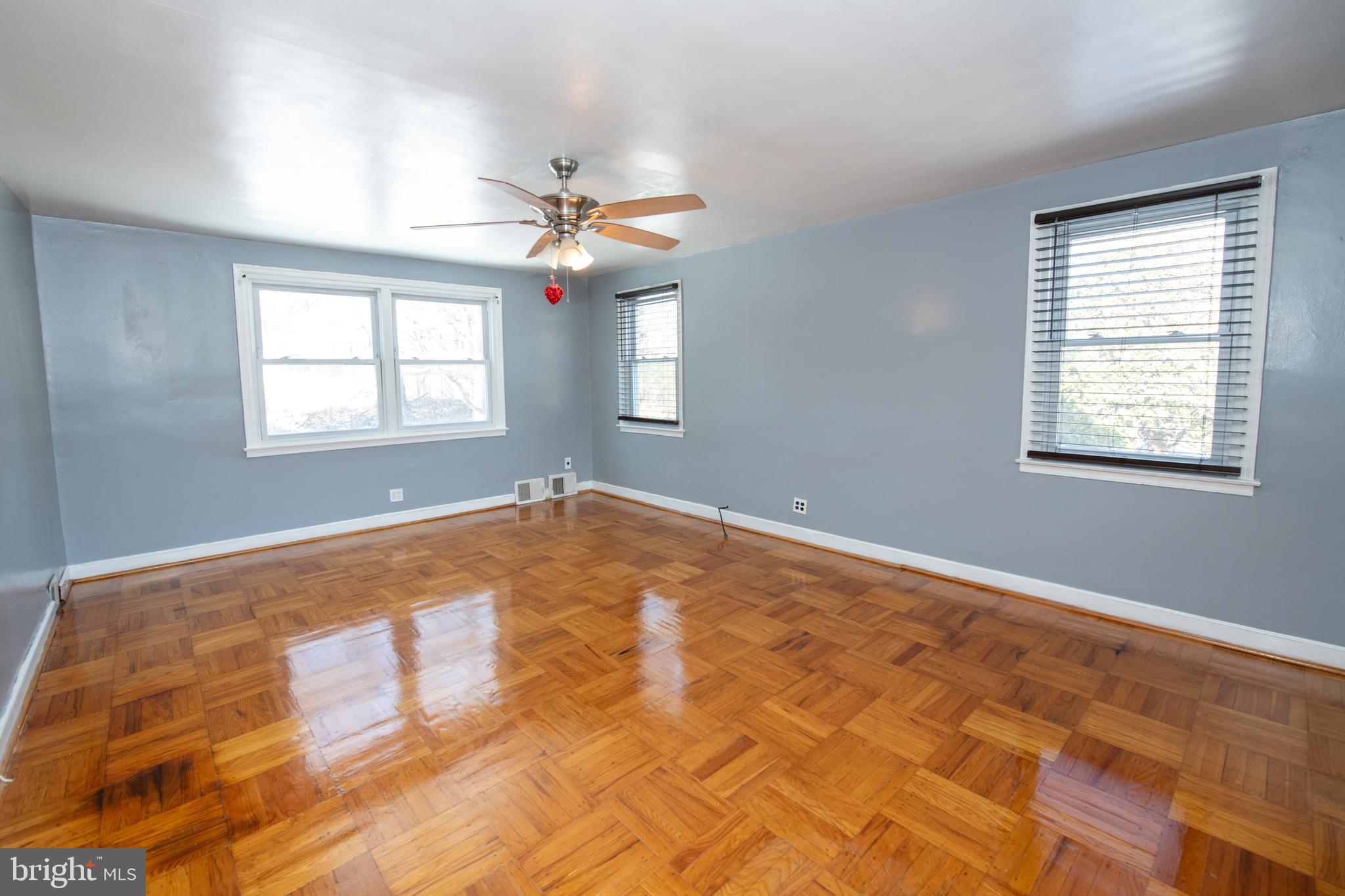 7820 Haines Road Cheltenham, PA 19012 - Photo 14 of 51 a view of a big room with windows and chandelier fan