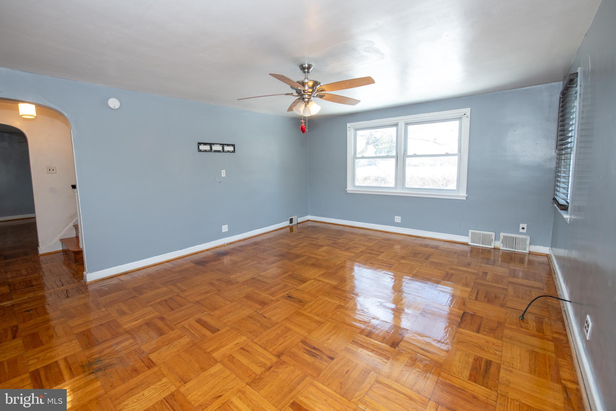 7820 Haines Road Cheltenham, PA 19012 - Photo 15 of 51 a view of a big room with windows and chandelier fan