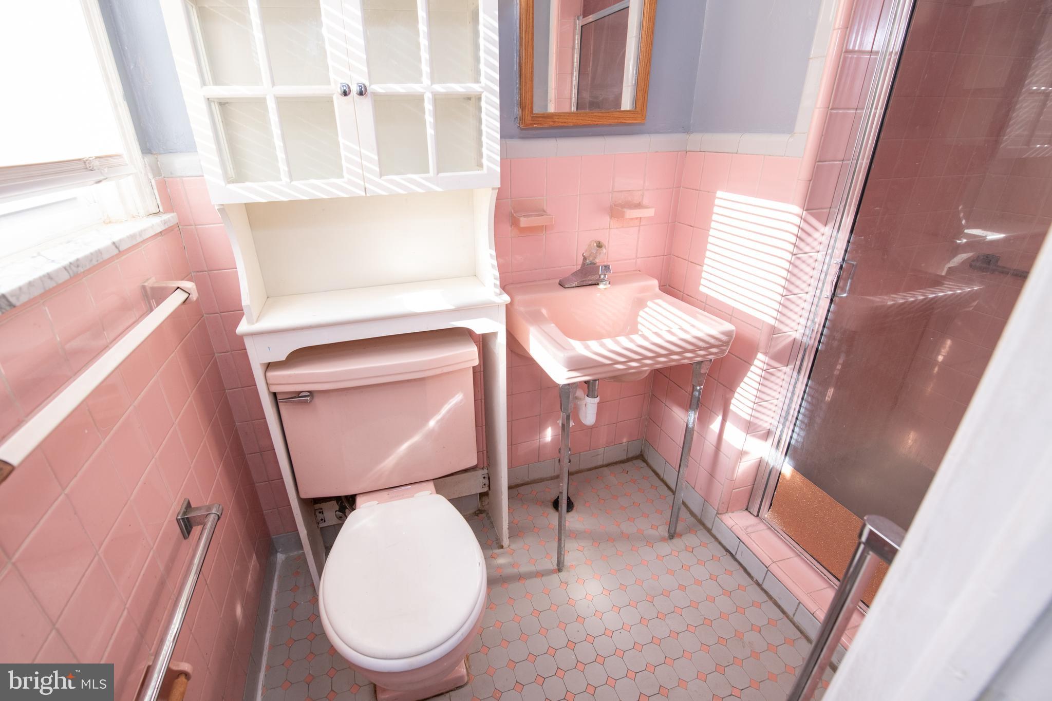 7820 Haines Road Cheltenham, PA 19012 - Photo 19 of 51 a bathroom with a toilet a sink and a mirror