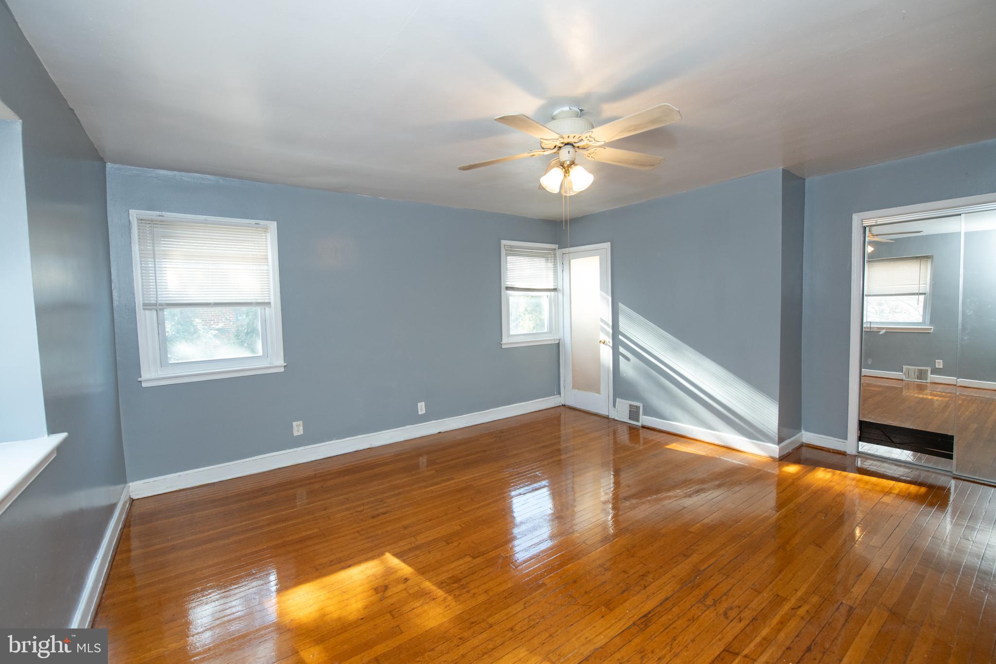 7820 Haines Road Cheltenham, PA 19012 - Photo 21 of 51 a view of an empty room with wooden floor and a window