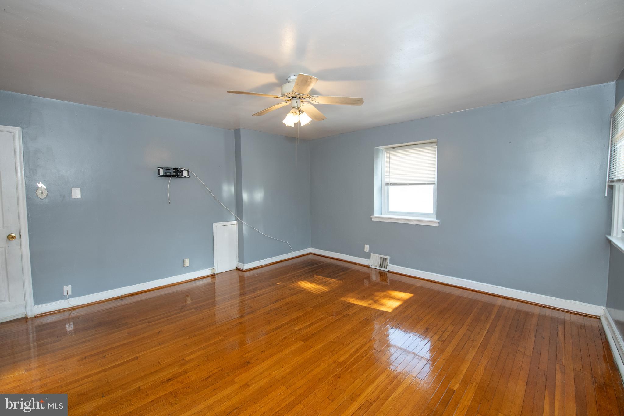 7820 Haines Road Cheltenham, PA 19012 - Photo 23 of 51 wooden floor in an empty room with a window