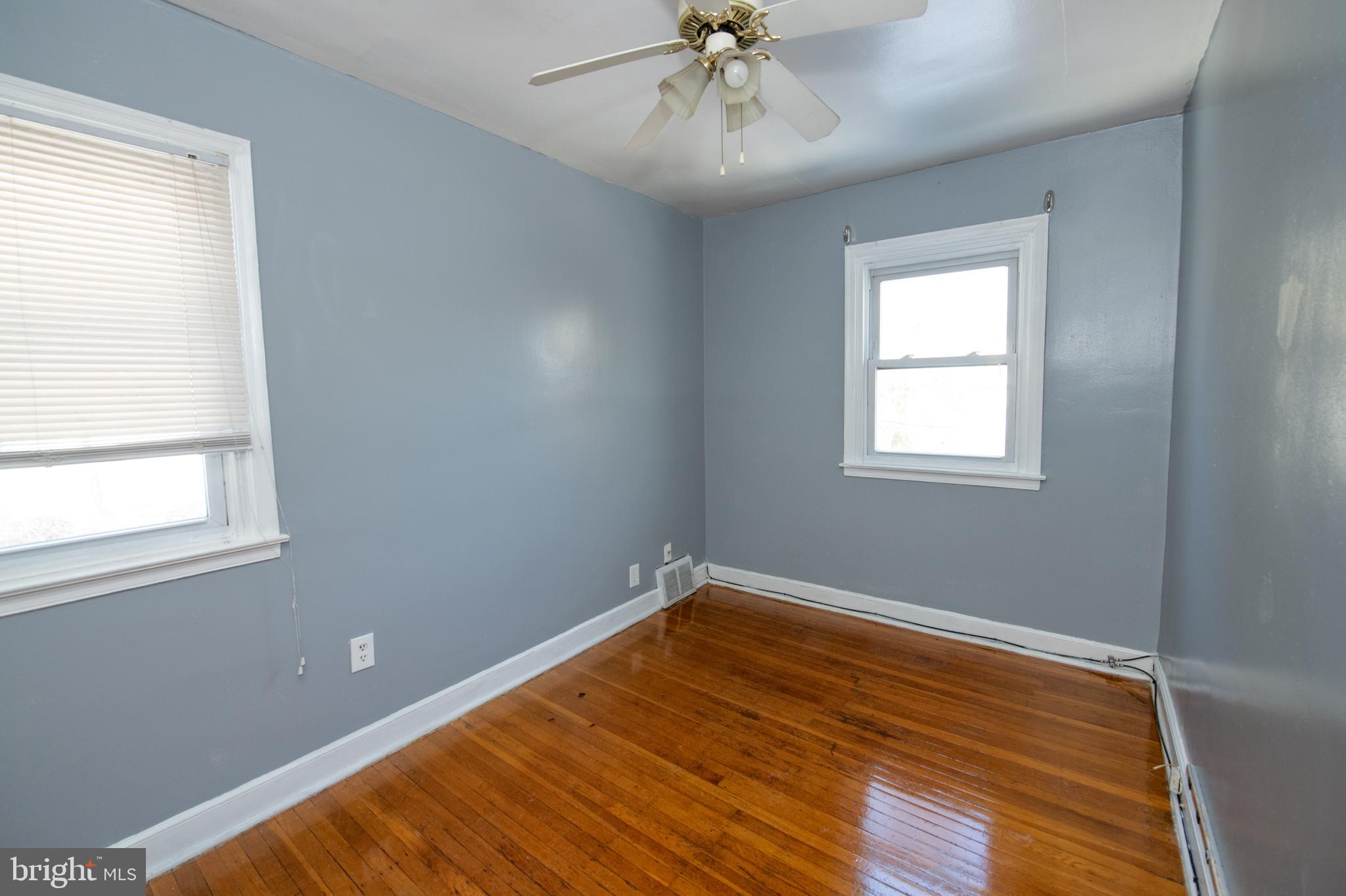 7820 Haines Road Cheltenham, PA 19012 - Photo 24 of 51 a view of an empty room with wooden floor and a window