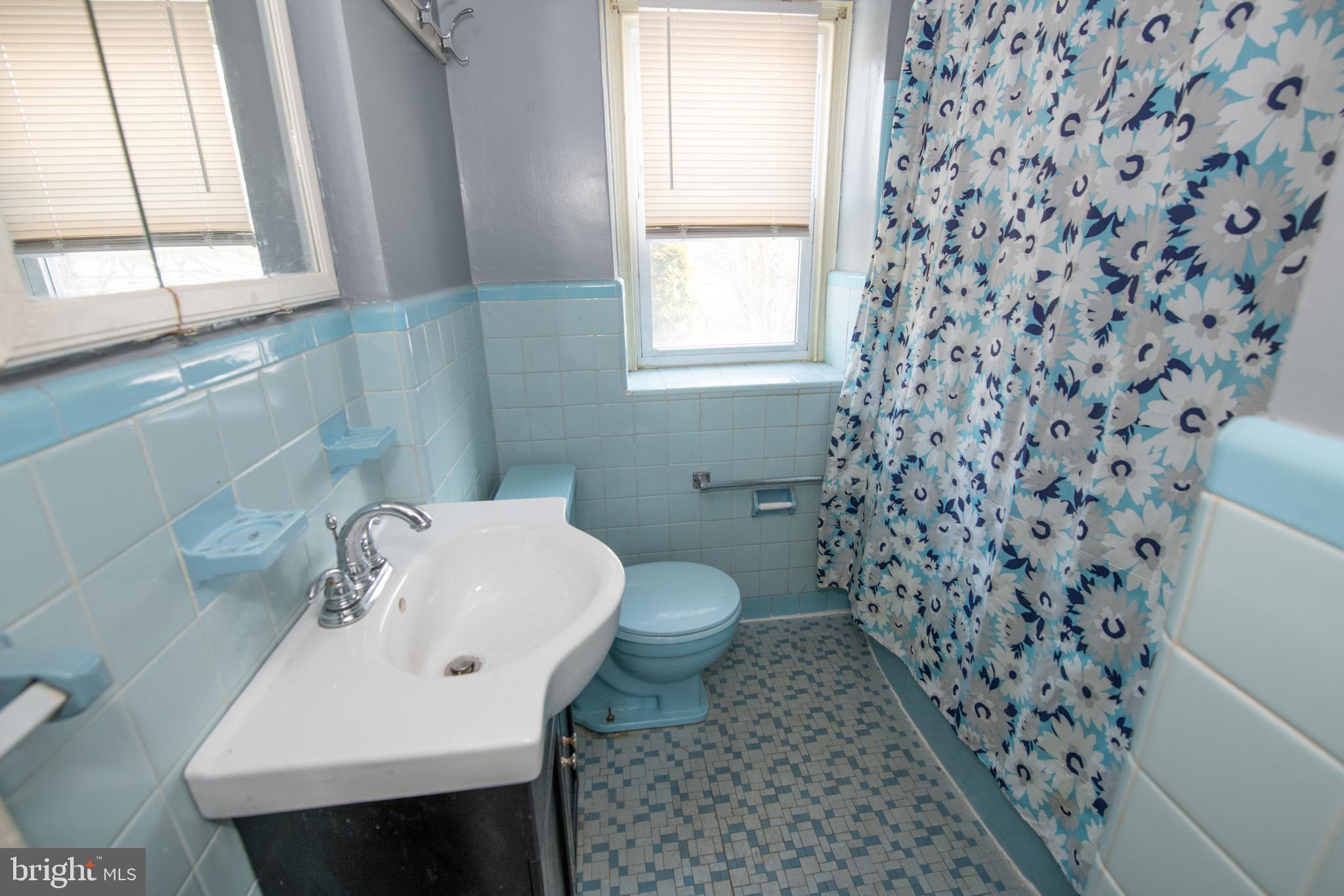7820 Haines Road Cheltenham, PA 19012 - Photo 30 of 51 a bathroom with a sink toilet and window